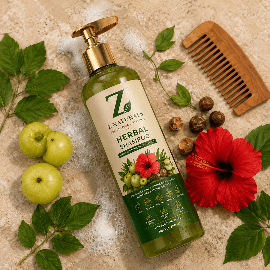 A hand holding the Z Naturals Herbal Shampoo bottle against a lush green leafy backdrop.